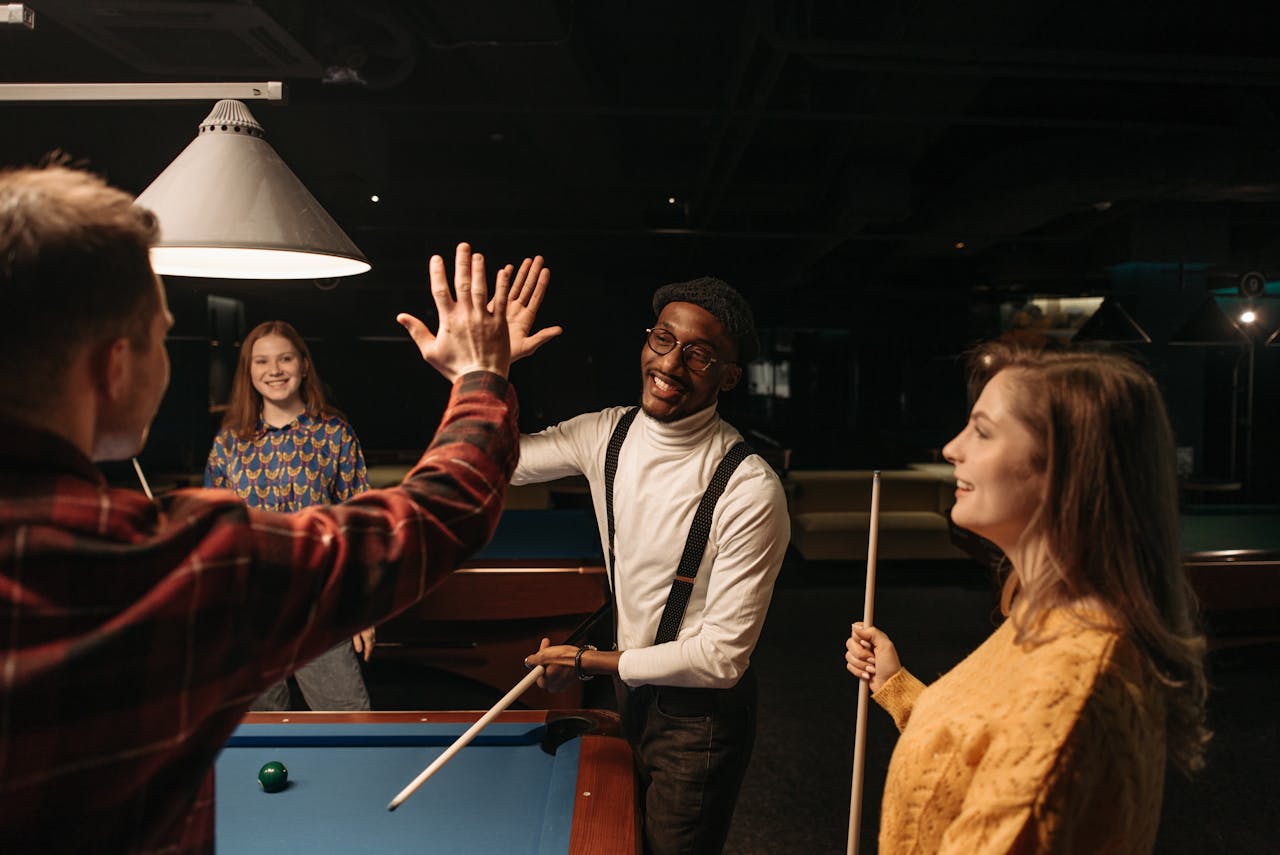 Adults enjoying luxury billiards leisure experience